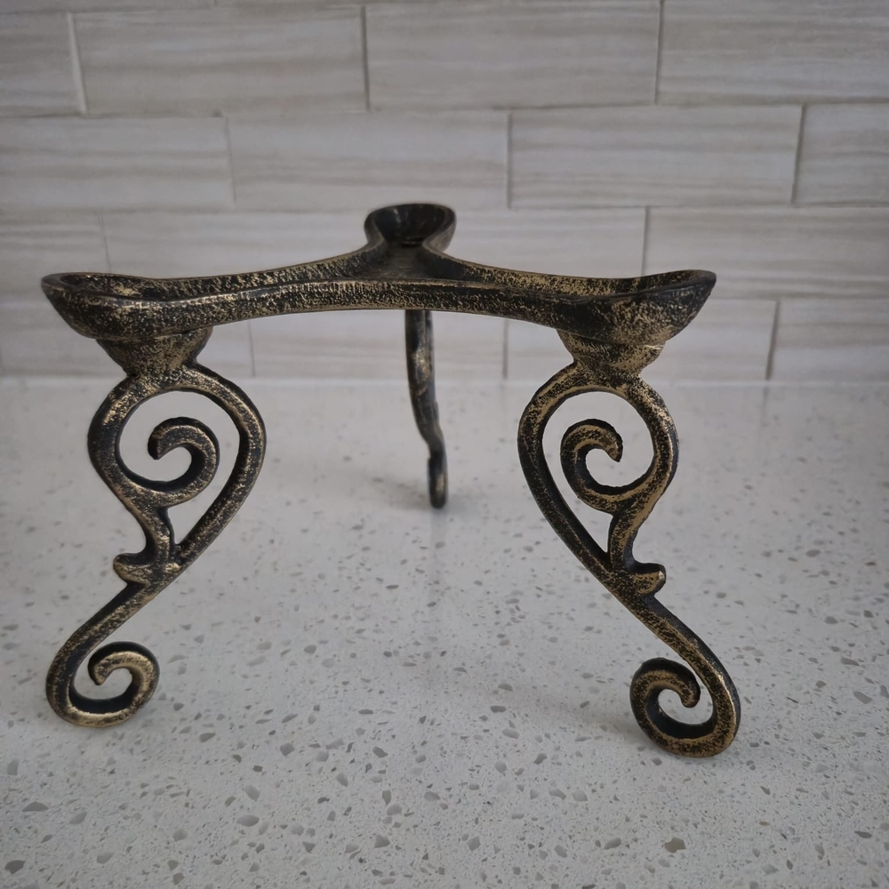 2 Ornate Cast Iron Stands: A Functional and Decorative Accent